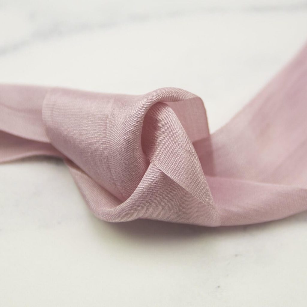 Pale pink silk ribbon.
