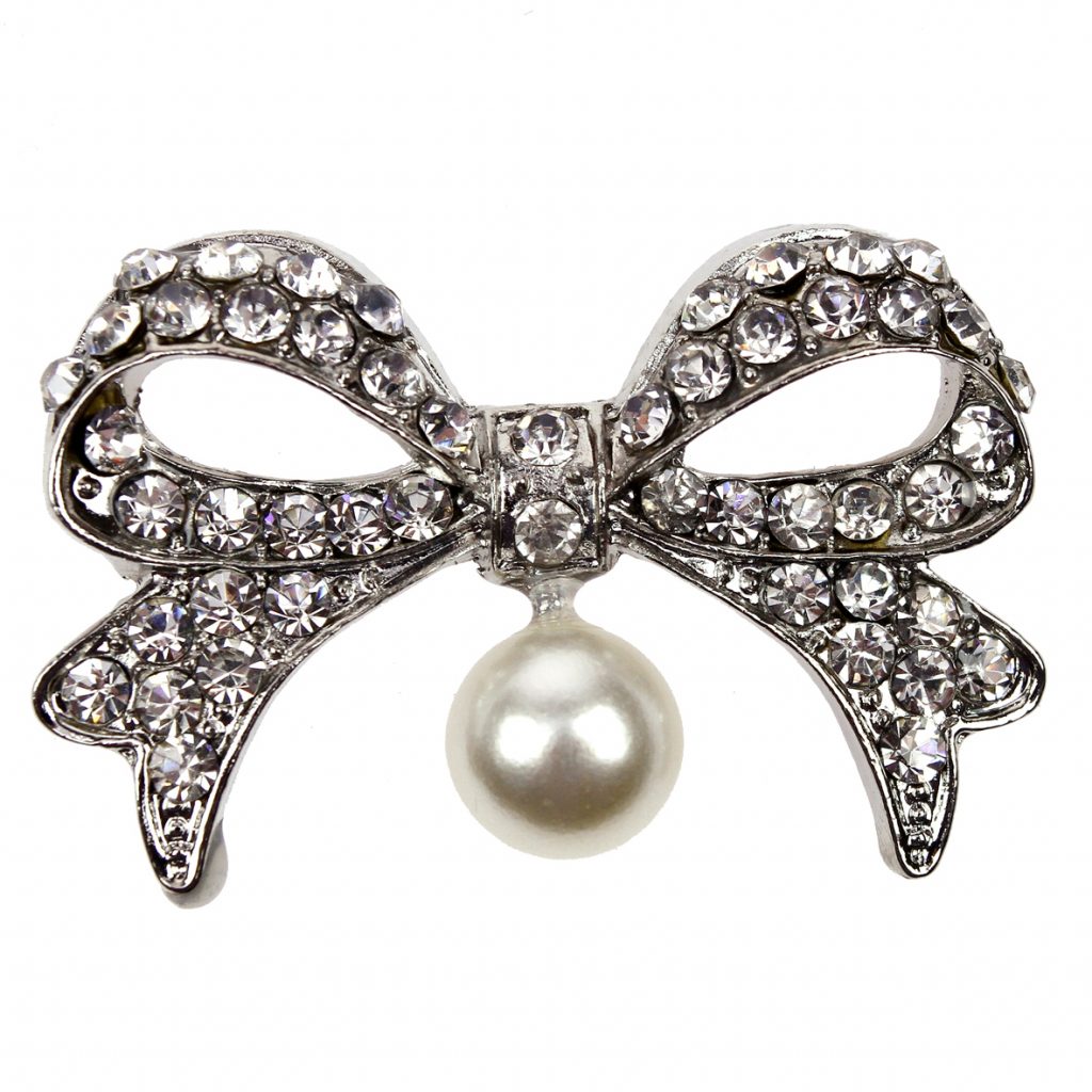A diamante pearl bow adds sparkle.