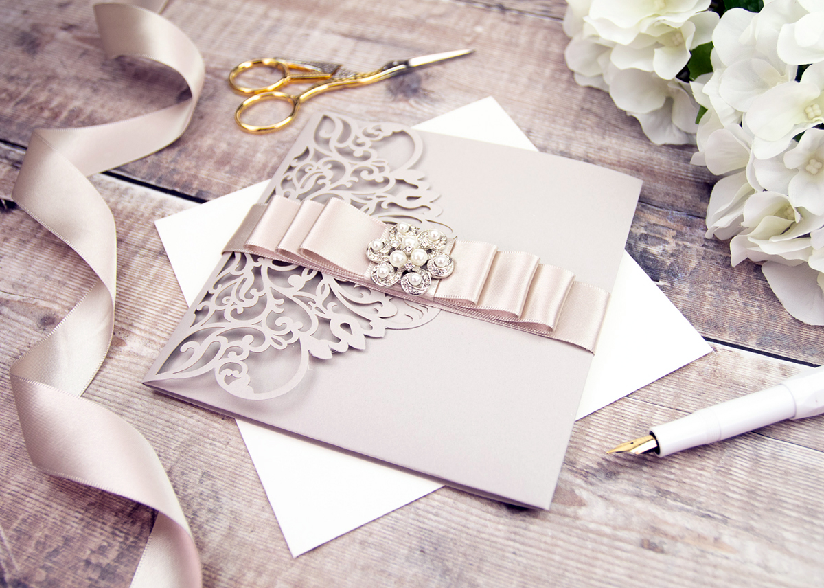 Adding beautiful finishing details like diamante embellishments complete your wedding invitation.