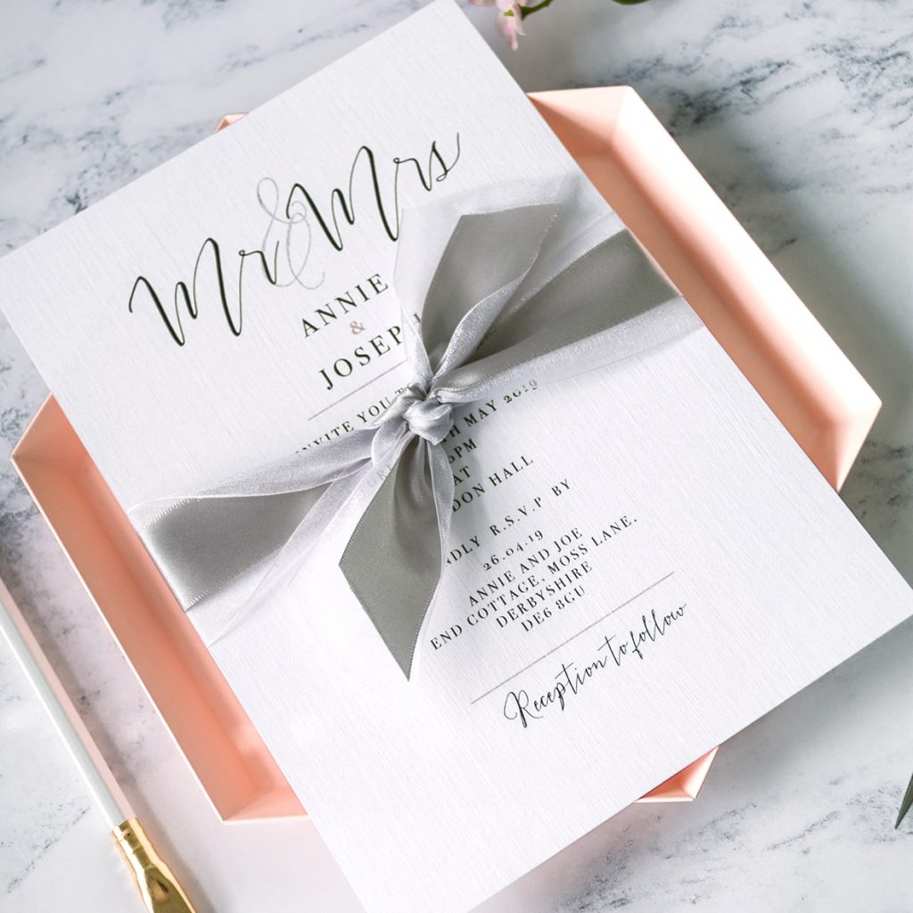 Weddings invitations using satin ribbon