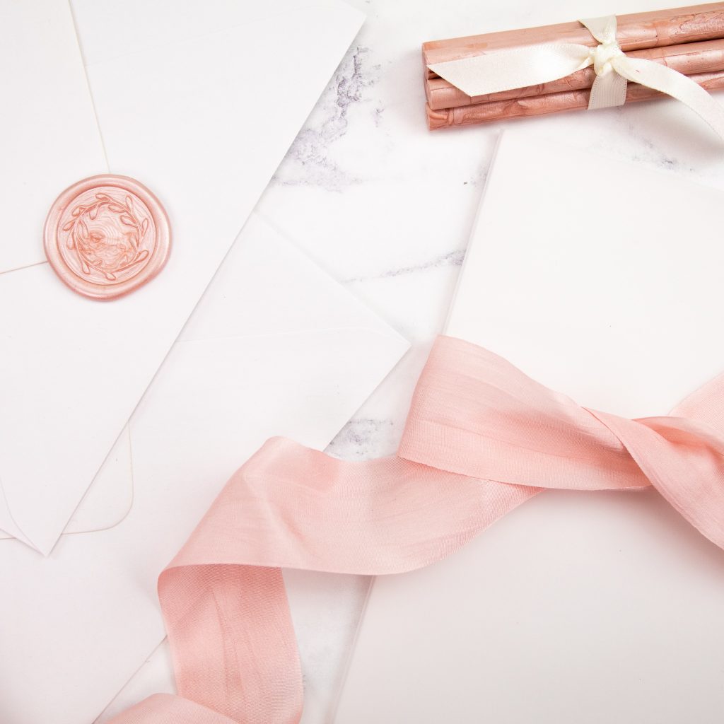 Pale pink silk ribbon and sealing wax